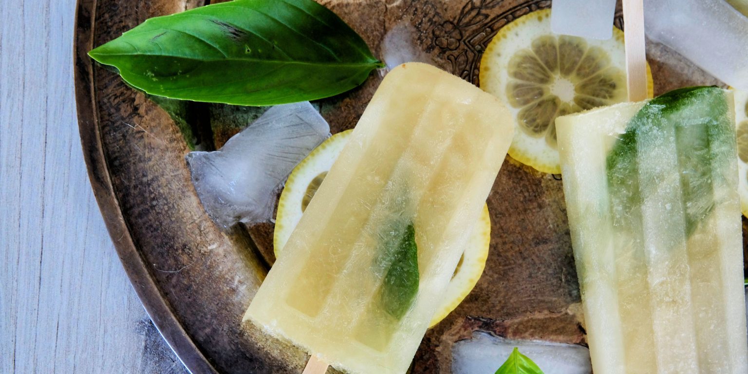 Boozy Popsicles boozy popsicles recipes, boozy pops, boozy summer popsicles, summer popsicles, adult popsicles, basil lemonade, how to make basil lemonade, how to make lemonade popsicles, dessert recipes, easy dessert recipes, frozen cocktails, frozen cocktail recipes, easy frozen cocktails, popsicles recipes