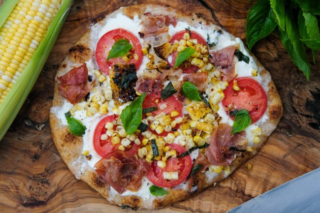 pizza with burrata, pizza with corn, pizza with prosciutto, naan pizza, summer pizza, easy pizza recipe, pizza recipe using naan, tomato corn pizza, pizza with burrata and tomato recipe, homemade pizza recipe