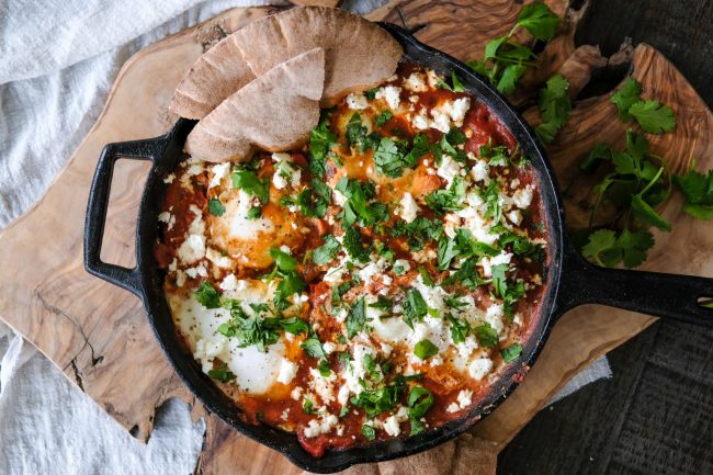 how to make Shakshuka, easy Shakshuka recipe, what is Shakshuka, Shakshuka with eggplant, eggs in purgatory, eggs in spicy tomato sauce, savory egg recipe, eggs in a spicy tomato sauce, baked eggs in tomatoes,