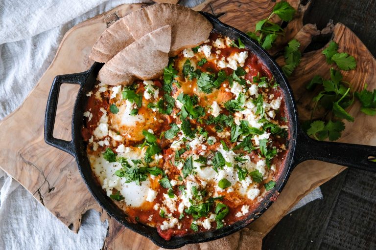 how to make Shakshuka, easy Shakshuka recipe, what is Shakshuka, Shakshuka with eggplant, eggs in purgatory, eggs in spicy tomato sauce, savory egg recipe, eggs in a spicy tomato sauce, baked eggs in tomatoes,