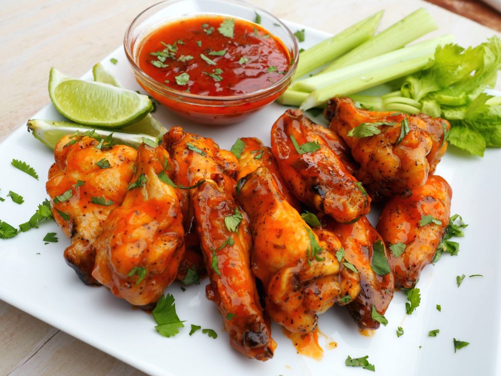 These spicy baked chicken wings have a delicious honey lime sauce. 