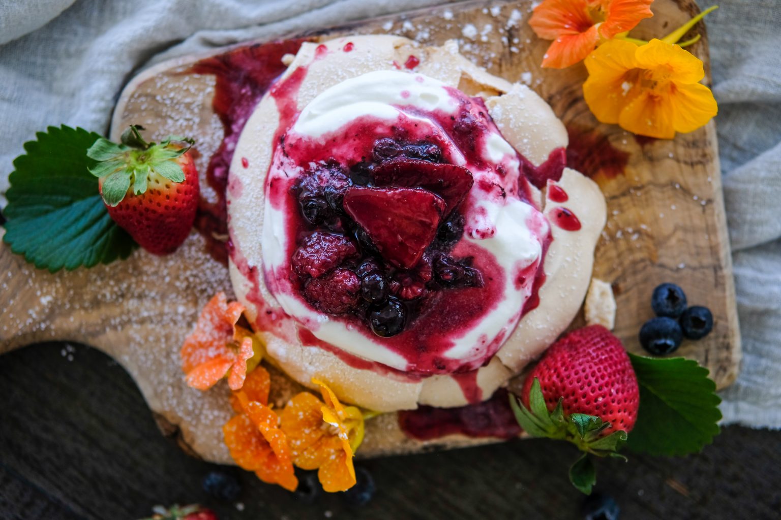pavlolva, how to make a pavlova, easy pavlova recipe, homemade pavlova recipe, gourmet dessert, roasted berries, sparkling wine roasted berries, roasted berries with whipped cream, spring dessert recipe, easy dessert recipes for spring, spring dessert recipes